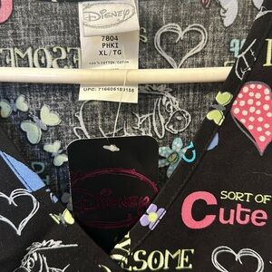 Add a touch of whimsy-Women’s scrub top-NWT featuring Disney’s Eeyore!!
